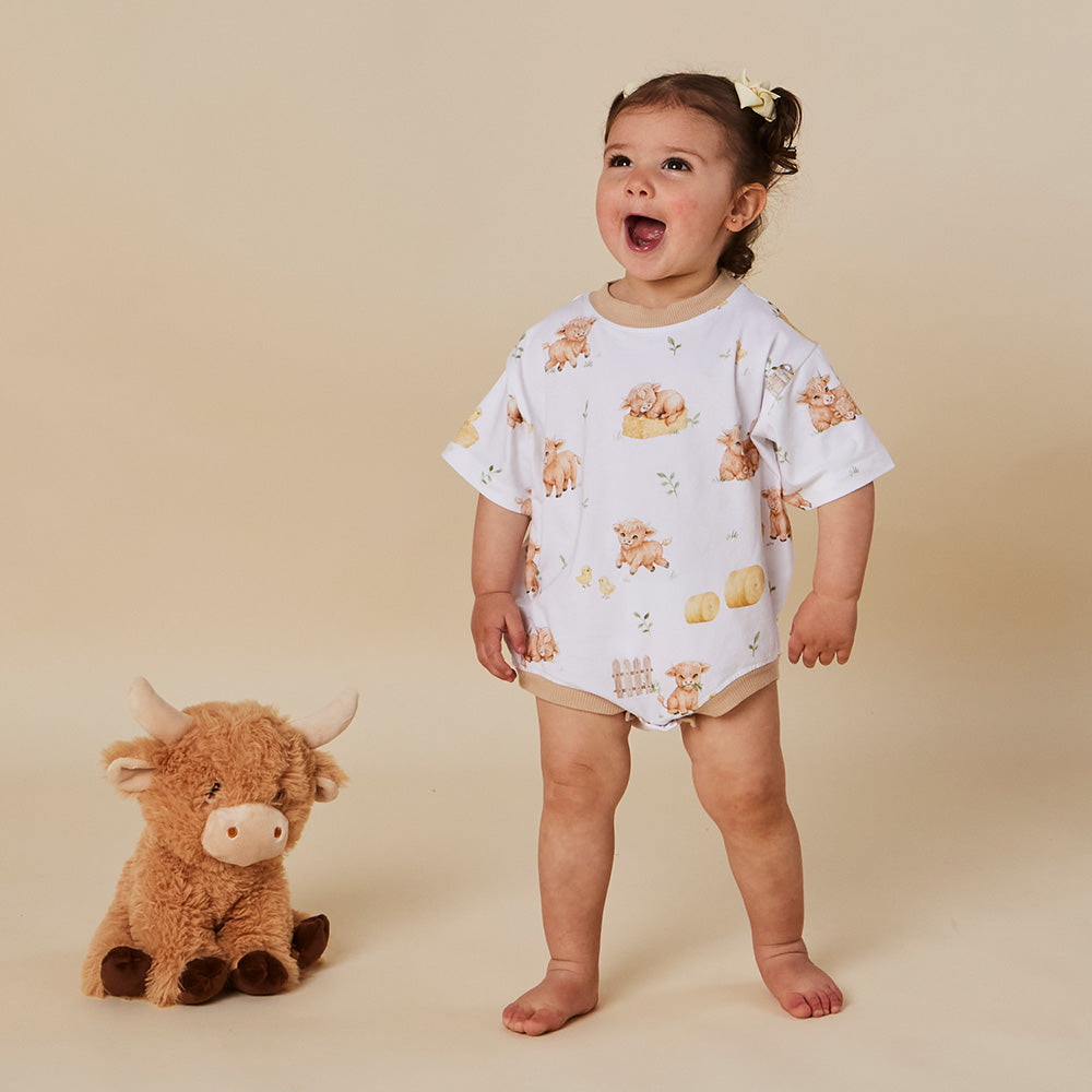 Snuggle Hunny Highland Cows oversized romper on baby