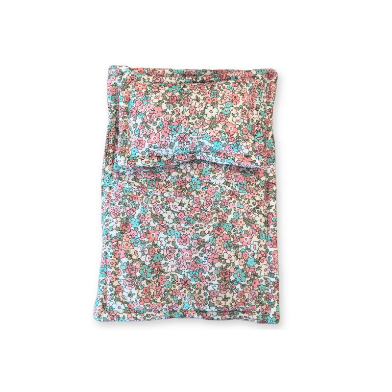 Close up of the pink floral print doll bedding
