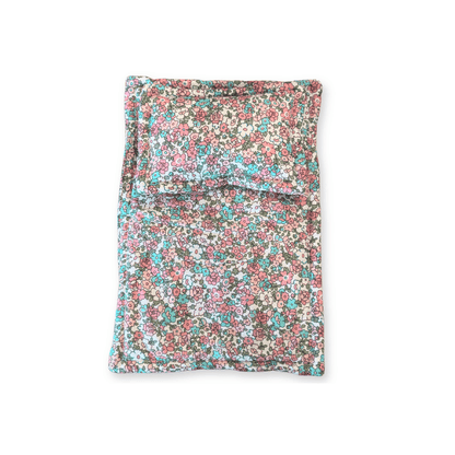 Close up of the pink floral print doll bedding