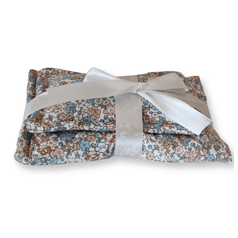 Close up of the blue floral print doll bedding
