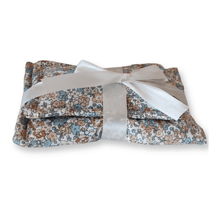 Close up of the blue floral print doll bedding