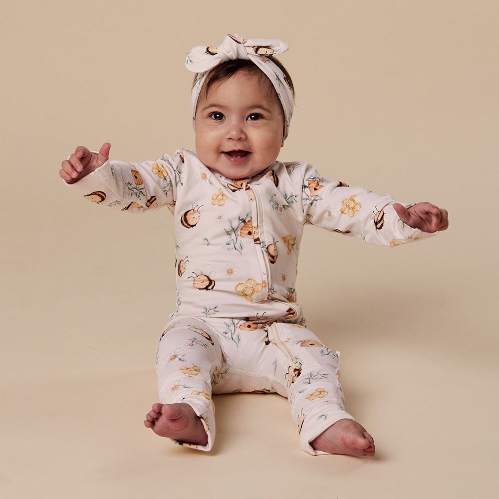 Baby wearing Snuggle Hunny Bumblebees organic snugglesuit convertible romper