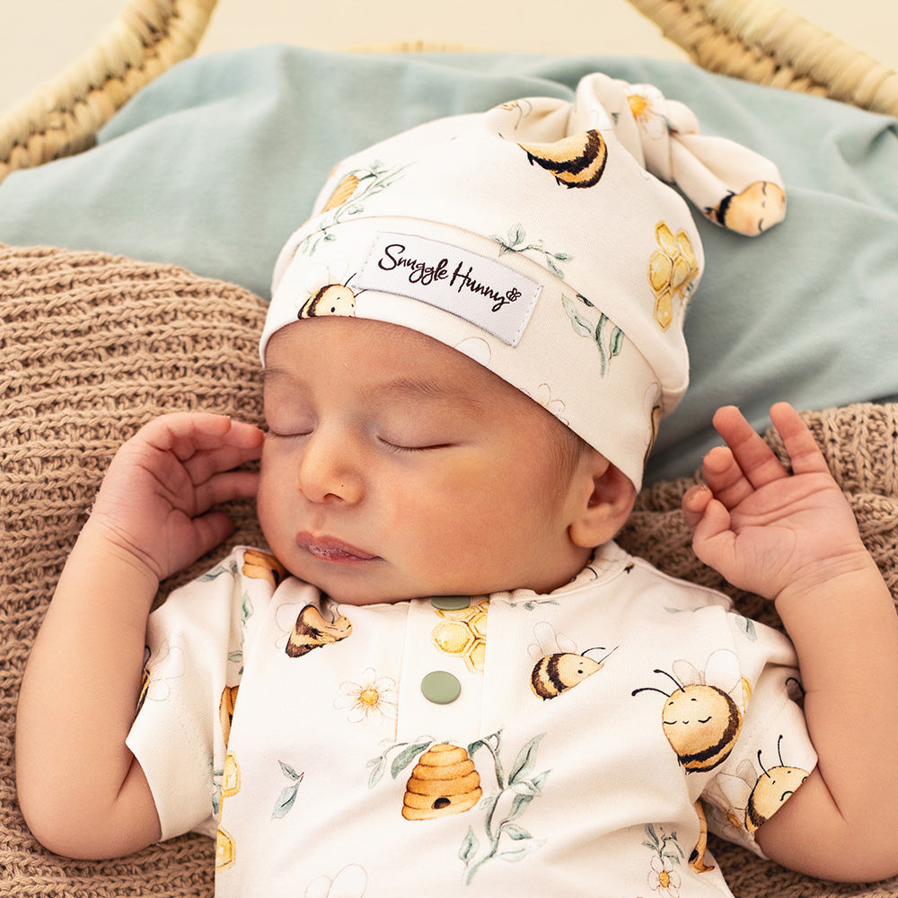 Baby wearing Snuggle Hunny Bumblebees organic knotted beanie