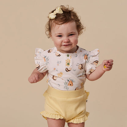 Snuggle Hunny Bumblebees bodysuit with frill on baby
