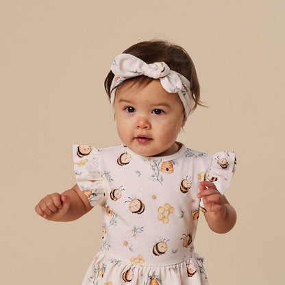 Snuggle Hunny Bumblebees organic topknot on baby
