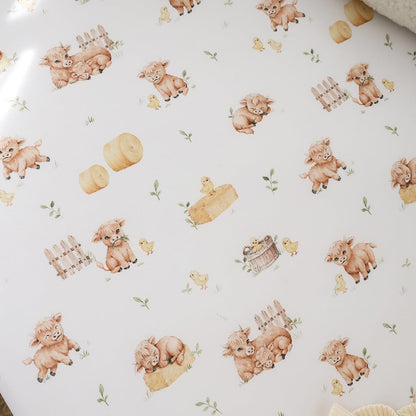 Snuggle Hunny Highland Cows fitted cot sheet lifestyle