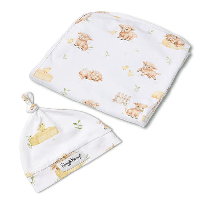 Snuggle Hunny Highland Cows jersey wrap and beanie set flatlay
