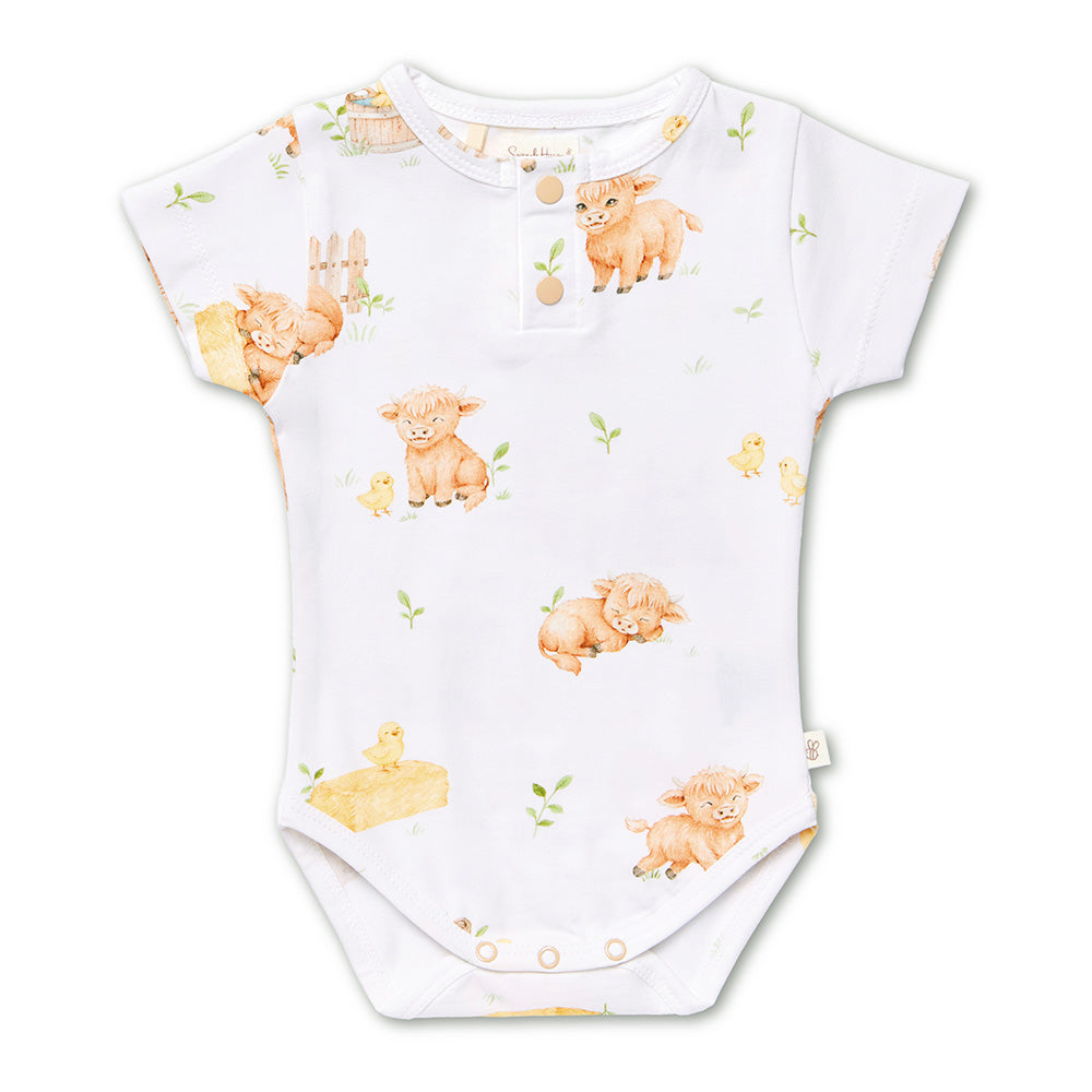 Snuggle Hunny Highland Cows short sleeve organic bodysuit flatlay