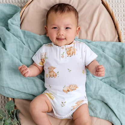 Snuggle Hunny Highland Cows bodysuit on baby