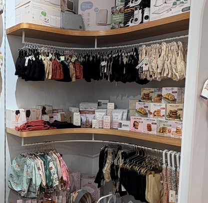 Mini + Mum boutique kids section with backpacks, books and toys