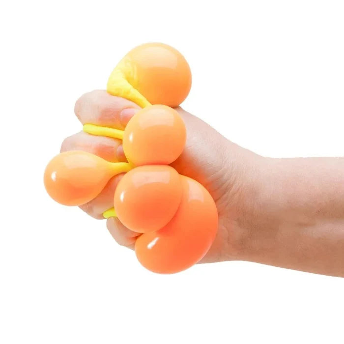 Yellow NeeDoh Colour Change Cube squeezed showing orange