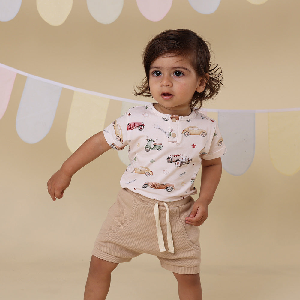 Snuggle Hunny Pebble organic shorts styled with bodysuit