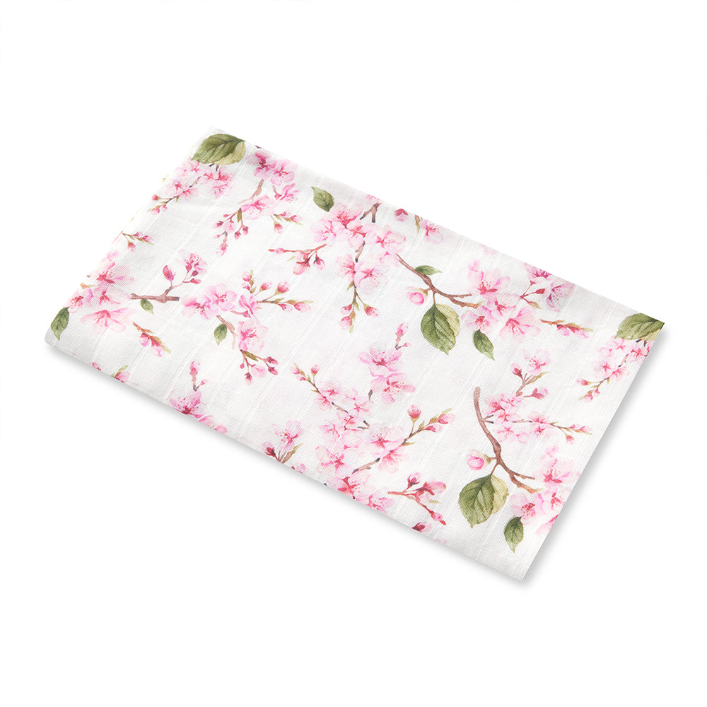 Snuggle Hunny Cherry Blossom organic muslin wrap flatlay