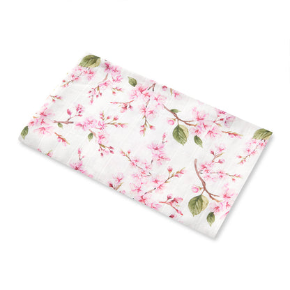 Snuggle Hunny Cherry Blossom organic muslin wrap flatlay